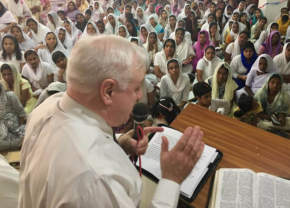 Man preaching to Indian Christians ministerial studies