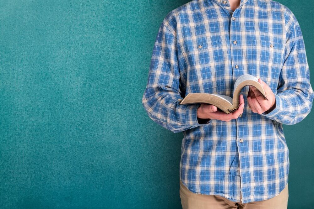man reading Bible