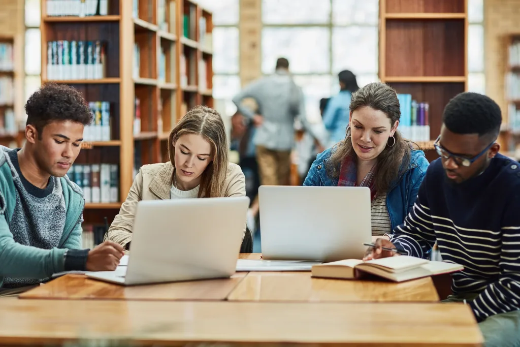 Group of friends studying in a library